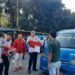 Camat Jonggol Jalankan Perintah Bupati Bagikan Bendera Merah Putih Jelang HUT RI KE-80