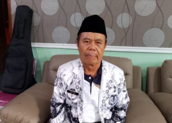 Ketua terpilih PGRI Cabang Gunung Putri Mad Toha saat memberikan sambutan dalam konferensi periode 2025-2030.